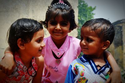 Siblings standing outdoors