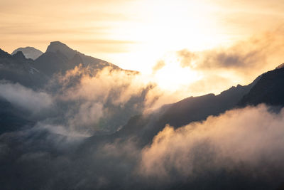 Scenic view of mountains against sky during sunset