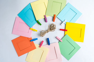 High angle view of colored pencils on white background