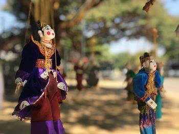 Puppets hanging outdoors