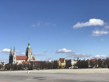 Buildings in city against sky