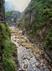 View of stone wall by mountains