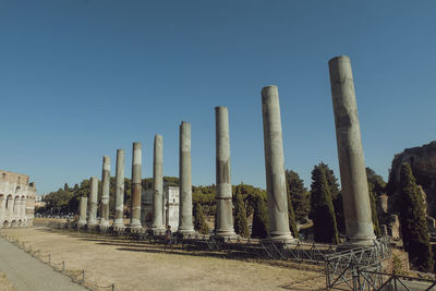 Panoramic shot of factory against clear blue sky