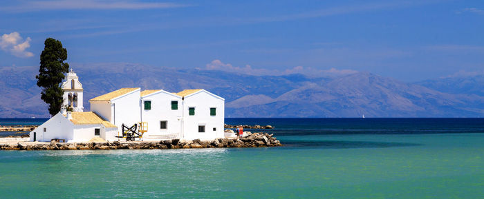 House by sea against sky