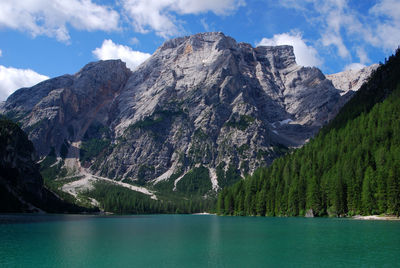 Scenic view of lake and mountains against sky