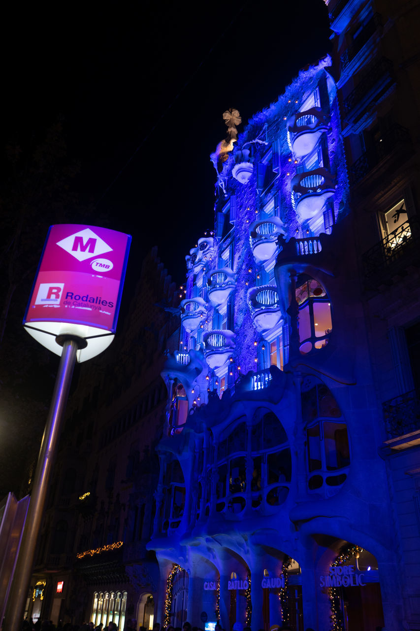 night, architecture, building exterior, illuminated, light, built structure, city, low angle view, travel destinations, lighting, sign, blue, communication, building, no people, street, darkness, travel, evening, outdoors, sky