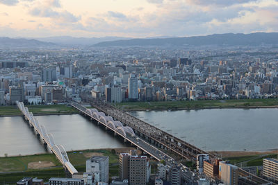 High angle view of river amidst buildings in city