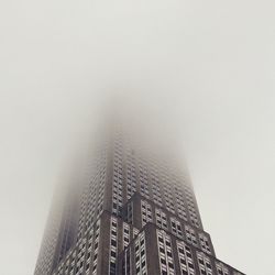 Low angle view of skyscraper against sky