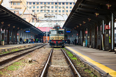 Train at railroad station in city