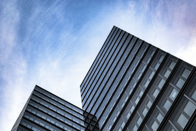 Low angle view of modern buildings against sky