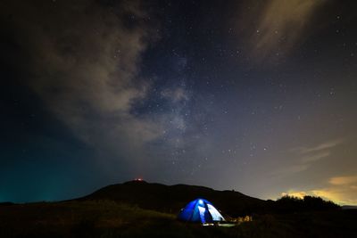 Scenic view of landscape against sky at night