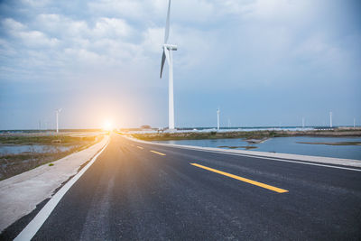 Road by street against sky