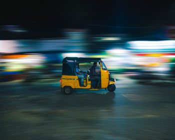 Blurred motion of car on road in city