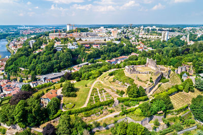 High angle view of townscape by sea against sky