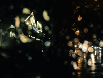 View of illuminated street at night