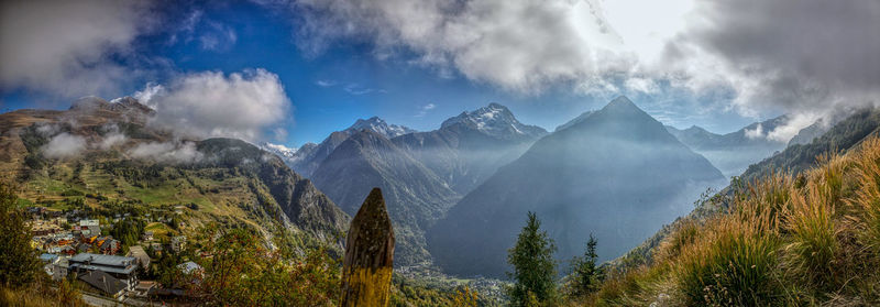 Panoramic view of trees and mountains against sky
