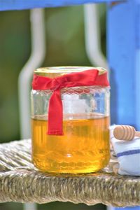 Close-up of drink in glass jar on table