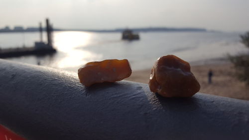 Close-up of sea against sky during sunset