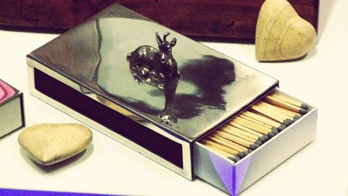 Close-up of cat on table