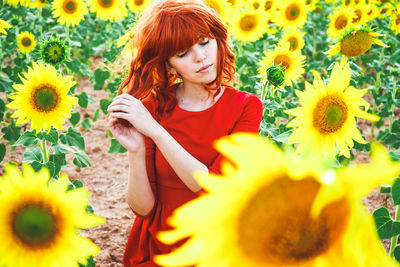 Portrait of woman with sunflower