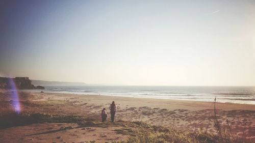 Family walking at beach