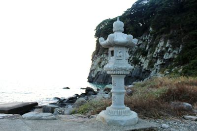 Statue in temple against clear sky