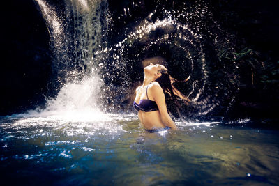 Woman swimming in pool