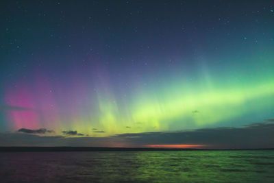 Scenic view of sea against sky at night