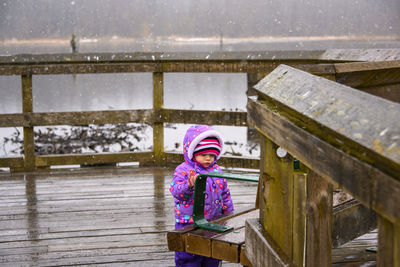 Portrait of cute girl in park during winter