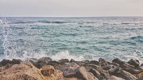 Scenic view of sea against clear sky