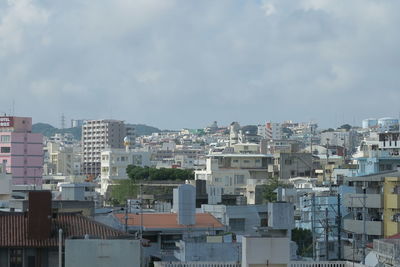 Buildings in city against sky