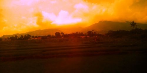 Scenic view of landscape against sky during sunset