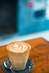 Close-up of cappuccino on table