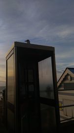 Silhouette of house in front of cloudy sky