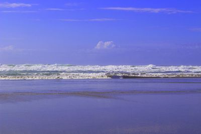 Scenic view of sea against blue sky