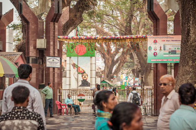 People walking on street in city