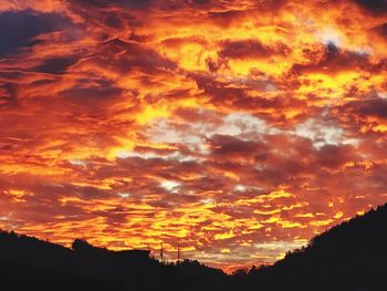 Low angle view of dramatic sky during sunset