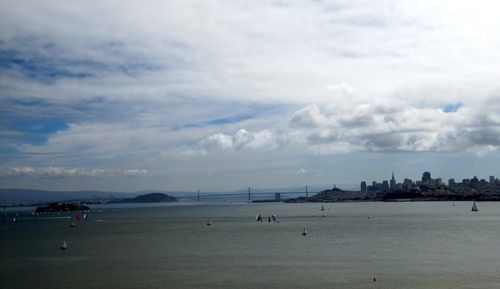 Scenic view of sea against cloudy sky