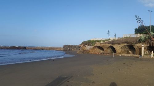 View of beach against clear sky