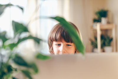 Portrait of cute boy at home