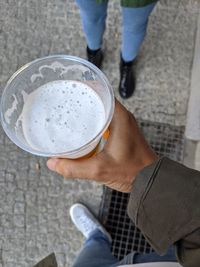 Low section of man holding drink