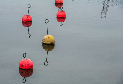 High angle view of red heart shape hanging over sea