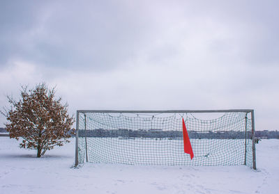 Scenic view of field against sky during winter