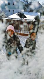 Portrait of smiling boy in snow