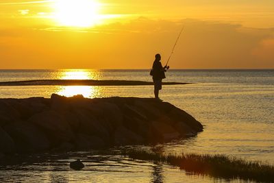 Scenic view of sea at sunset