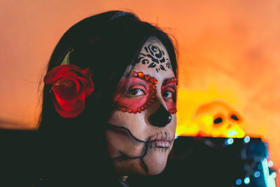 Close-up portrait of young woman with face paint during halloween