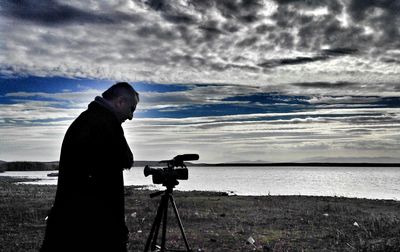 Scenic view of sea against cloudy sky