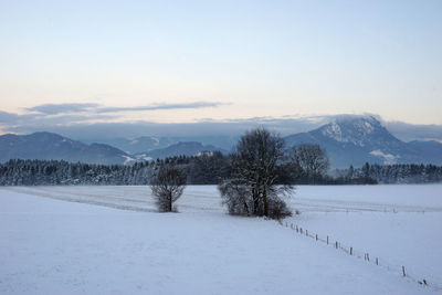 Scenic view of mountains against sky during winter