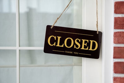 Close-up of text on glass door