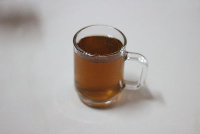 Close-up of tea cup against white background